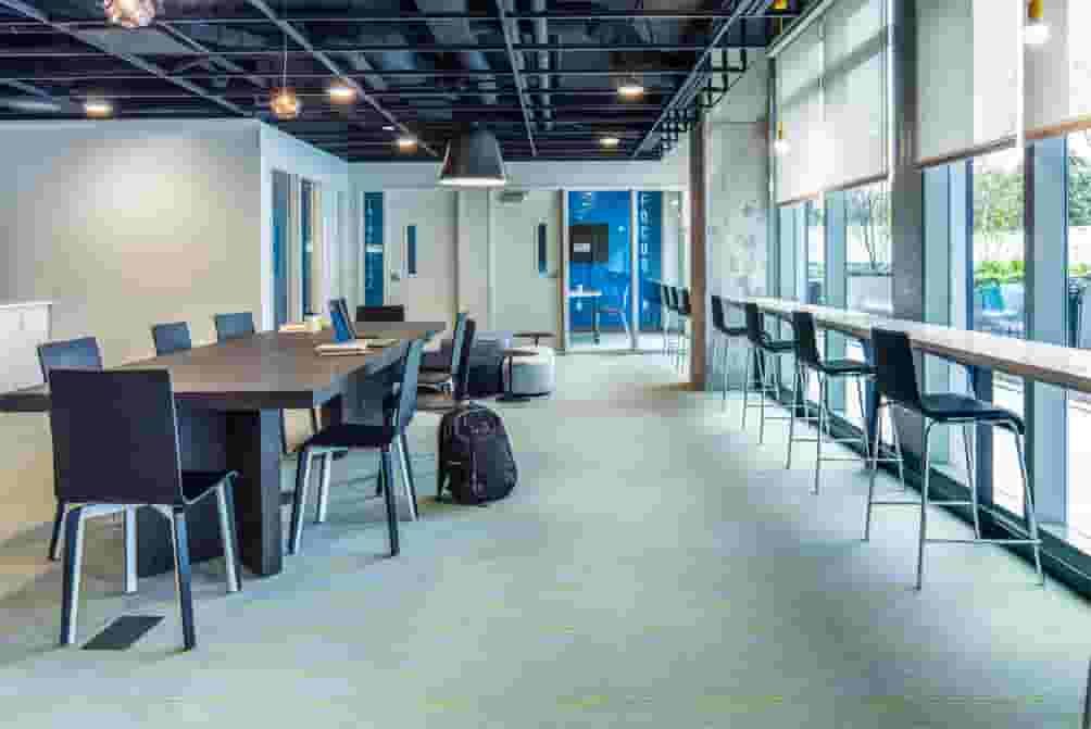 Large conference table in the Study Lounge at Rise at Riverfront Crossings