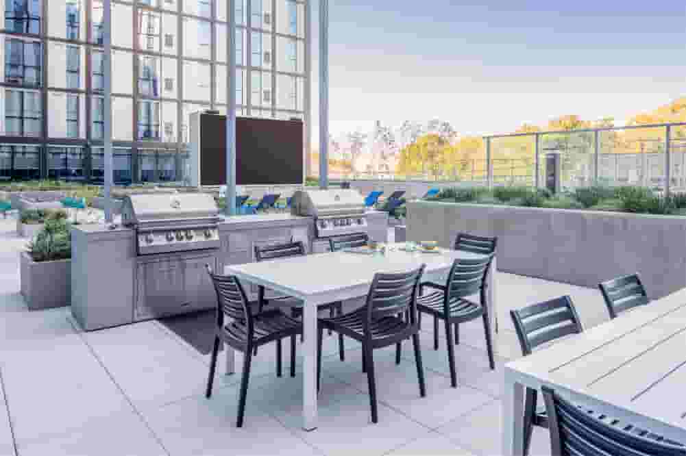 Commercial grills in the courtyard with Jumbotron in the background