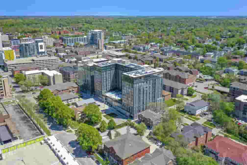 Aeiral view of Rise at Riverfront Crossings against Iowa City backdrop