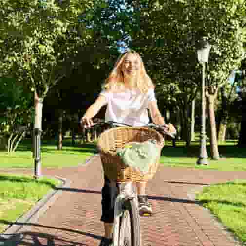 Student riding bike near The University of Iowa campus