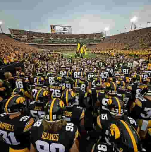 Football team waiting to rush the field at Kinnick Stadium