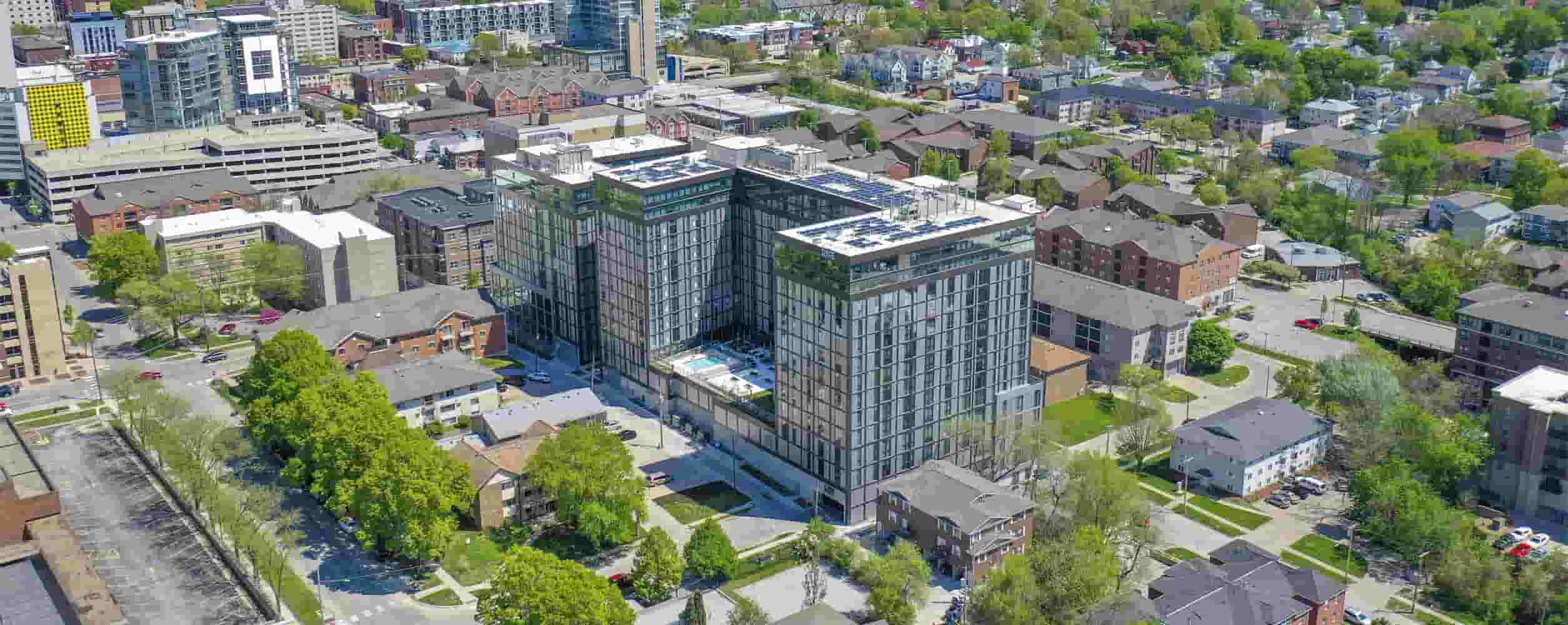 Aerial exterior view of RISE at Riverfront Crossings against Iowa City surroundings