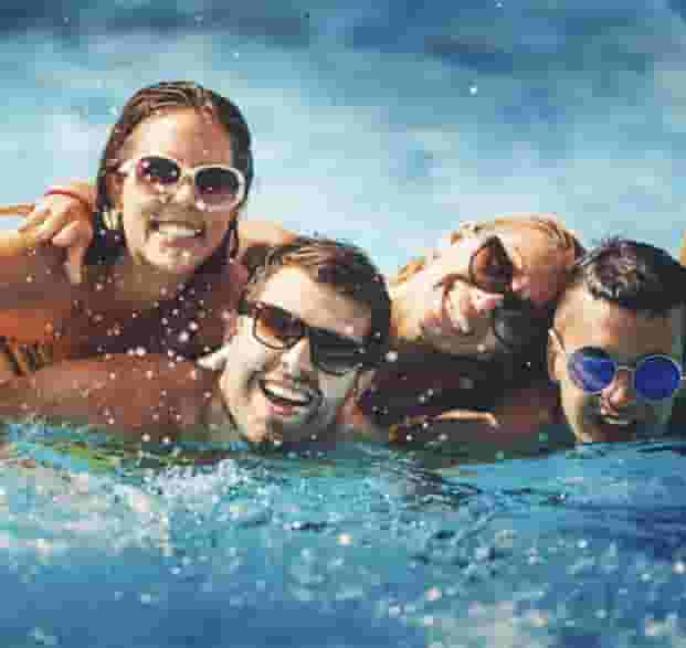 Group of residents splashing in Rooftop Pool