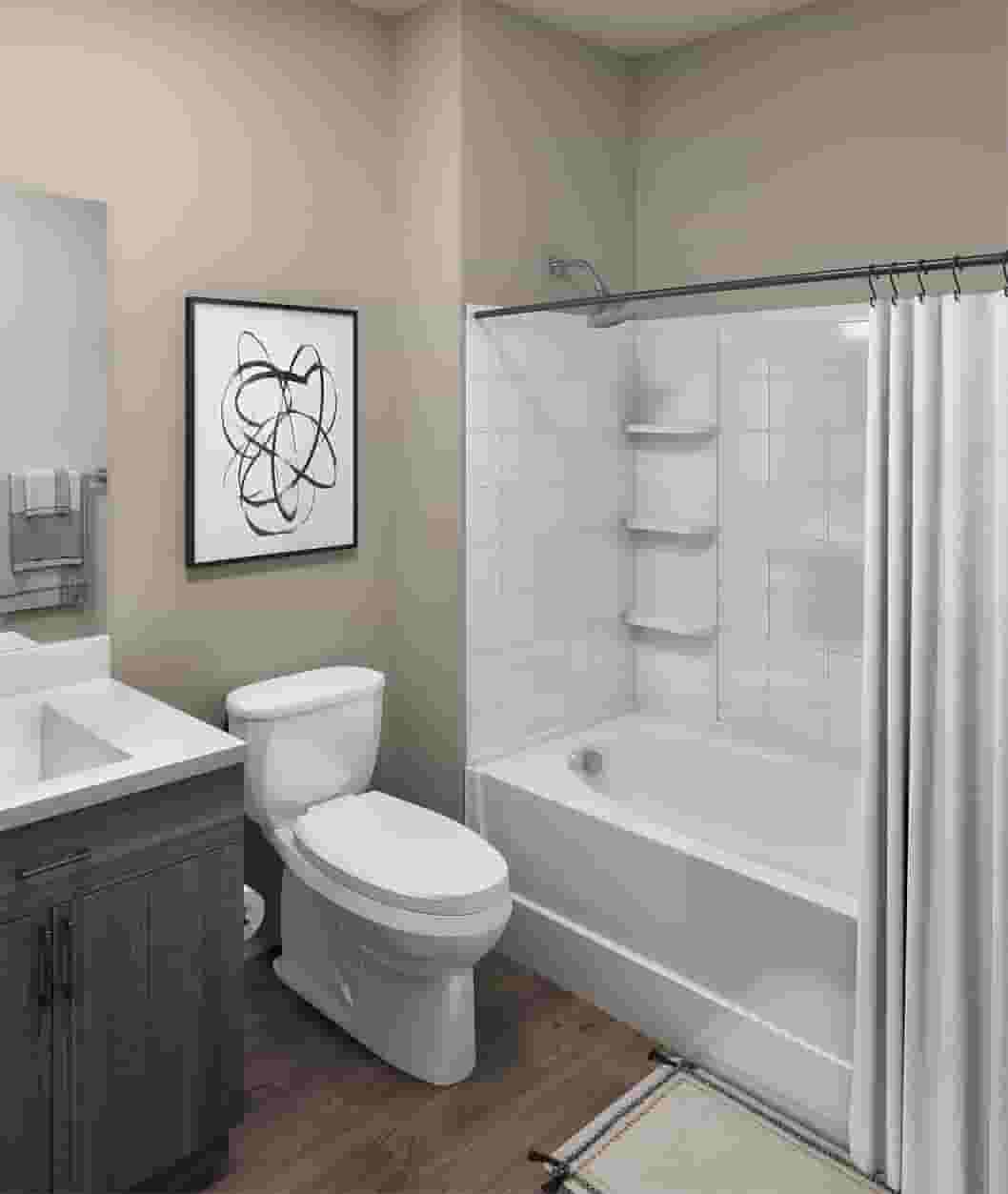 Bathroom photo showing vanity, toilet, and shower at The Jolly Roger