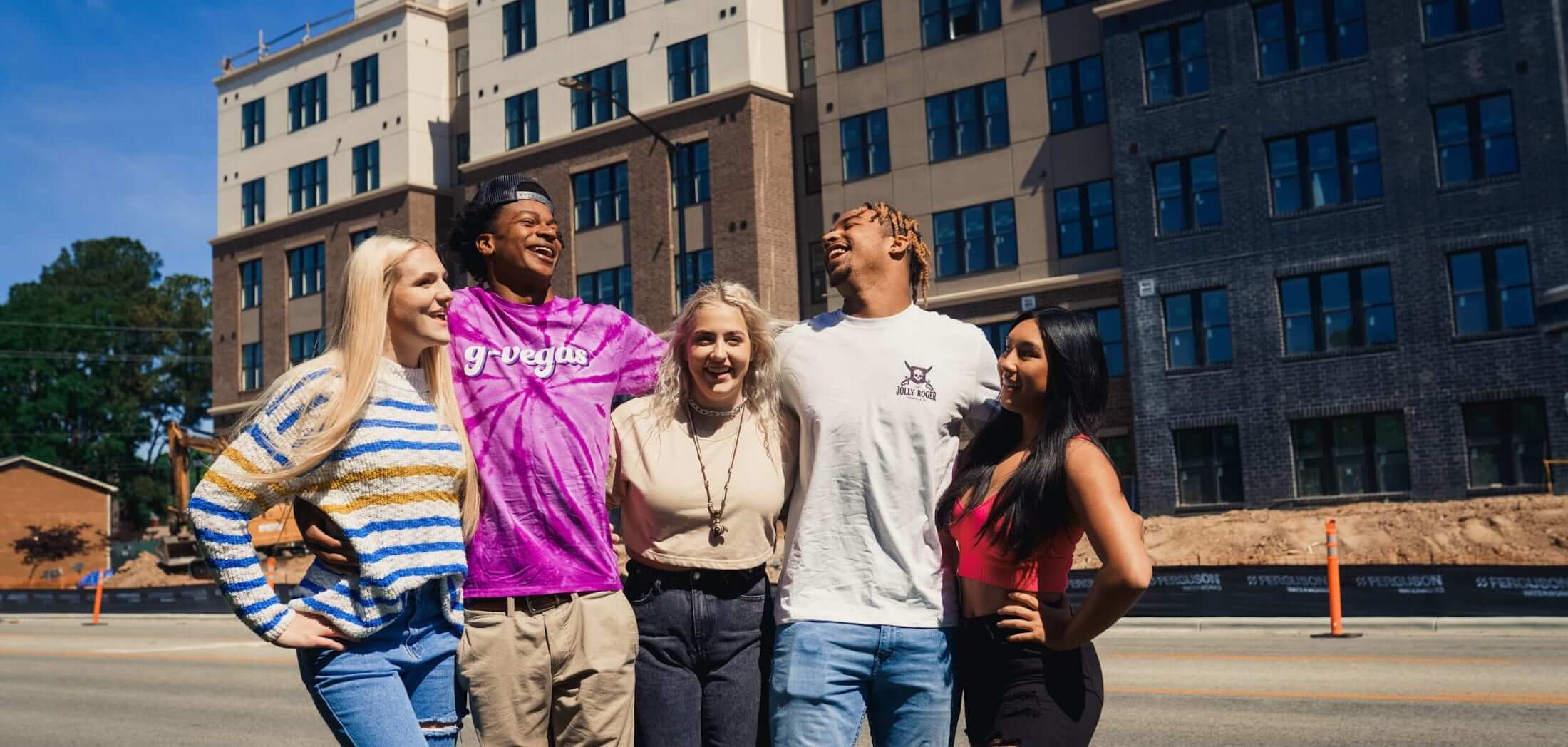 The Jolly Roger residents laughing outside of the community