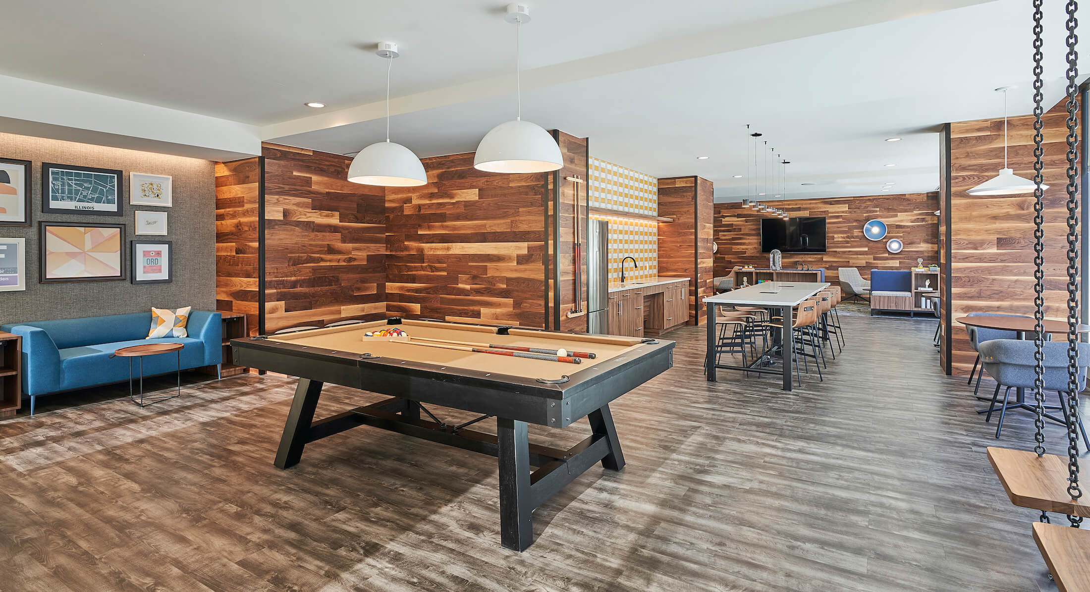 Club and Game Room at The Link Evanston with pool table, lounge seating, kitchenette, large dining table, and TV area